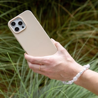 UNIQ Coehl Perla Handstrap universāla telefona rokas siksniņa balts/balts pearl