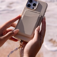 UNIQ Coehl Perla Handstrap universāla telefona rokas siksniņa balts/balts pearl