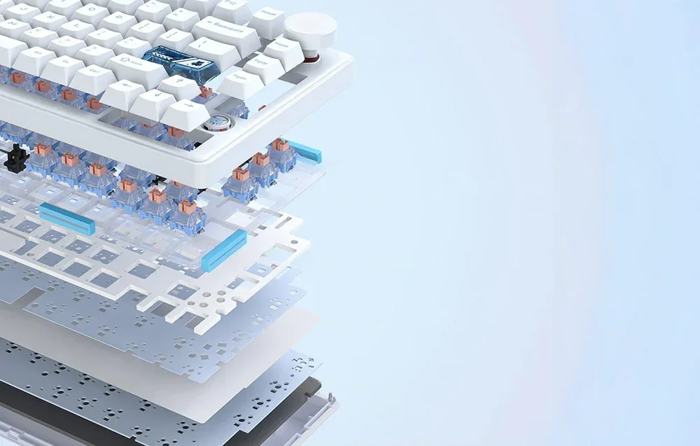 White keyboard laid out in several pieces on a blue background