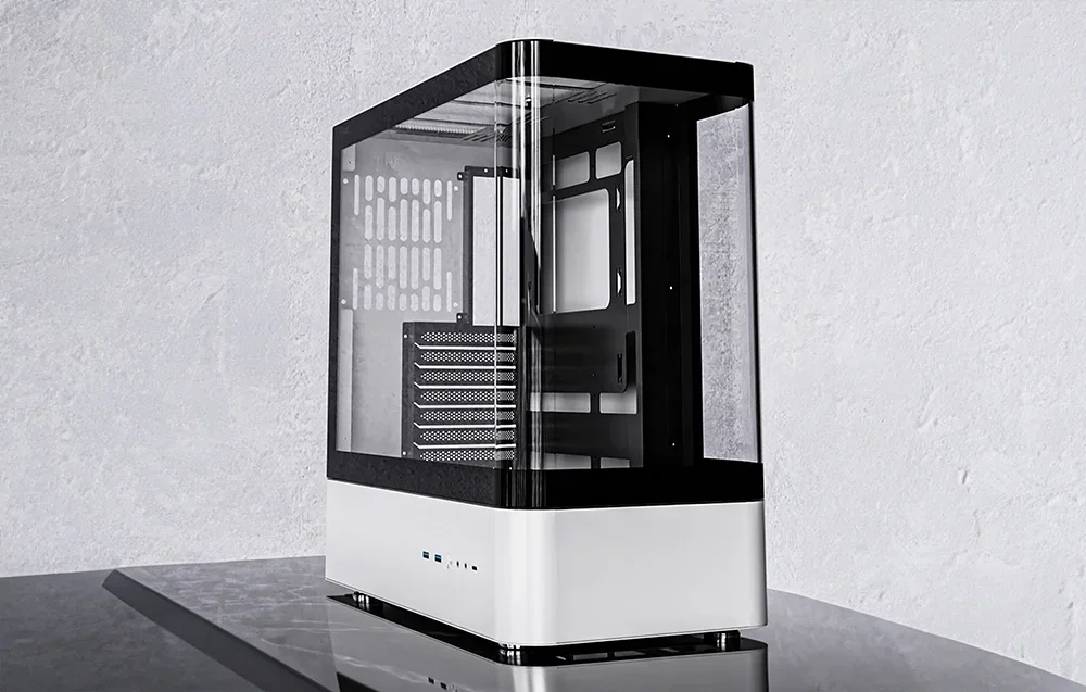 White and black computer case on a stone table top